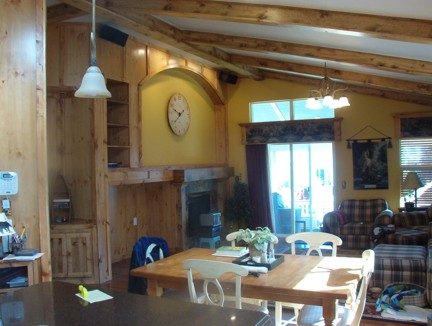 Living room with fireplace and exposed wood beams